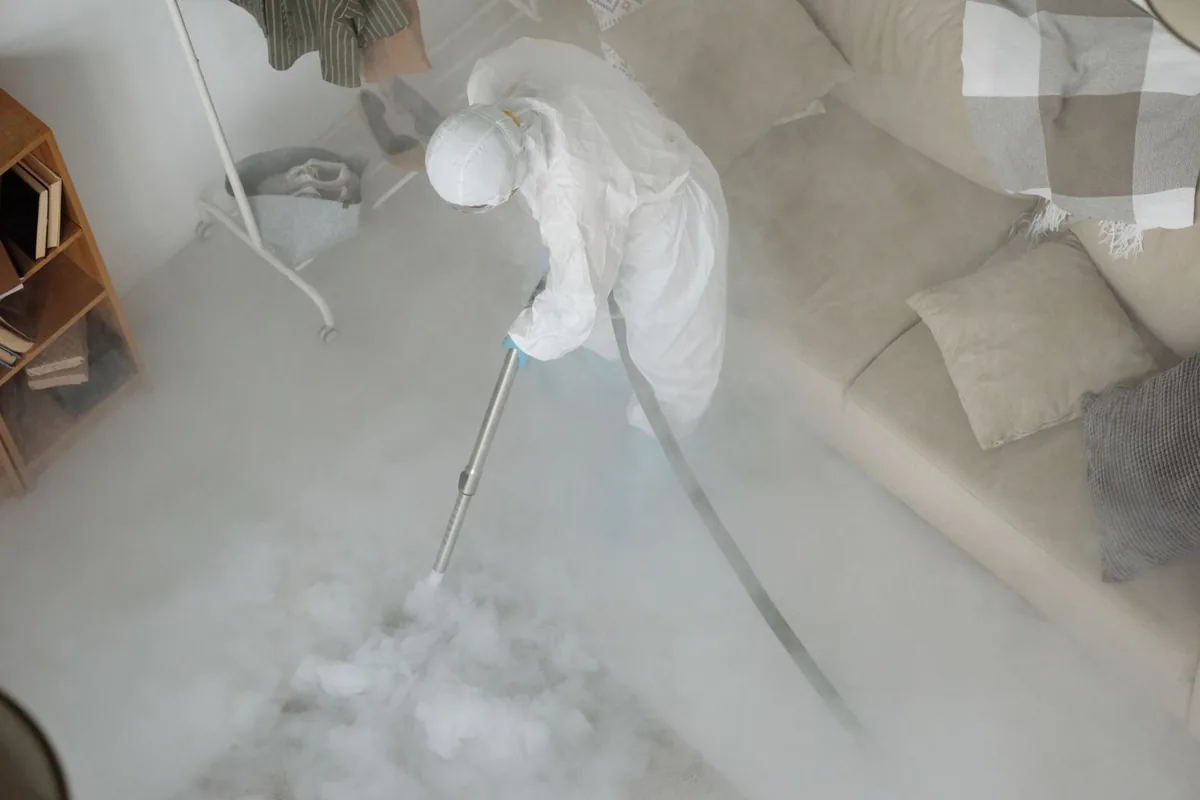 Biohazard cleanup technician in protective equipment, Aurora, MN